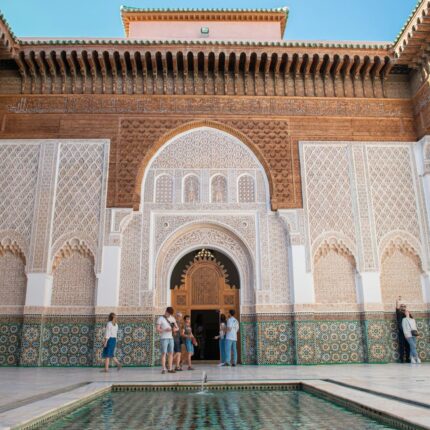 A group of people standing around a pool in a building