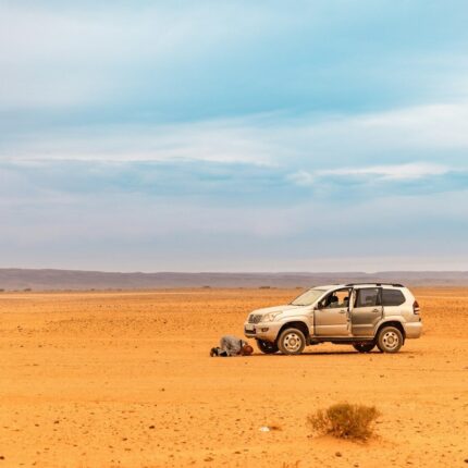 a car parked in the middle of a desert